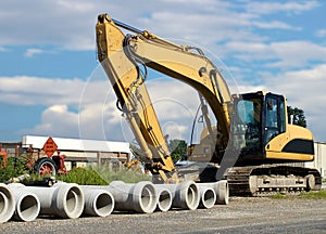 Cement pipes with backhoe