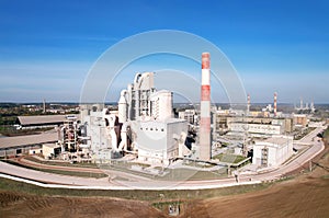 Cement plant with pipes. Ð¡ement production process and Industrial solution. factory with smoke pipe. Chimney smokestack emission