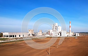 Cement plant with pipes. ÃÂ¡ement production process and Industrial solution. factory with smoke pipe. Chimney smokestack emission