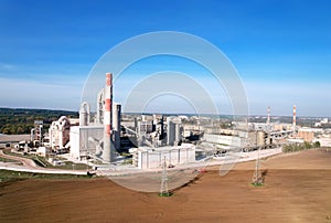 Cement plant with pipes. ÃÂ¡ement production process and Industrial solution. factory with smoke pipe. Chimney smokestack emission