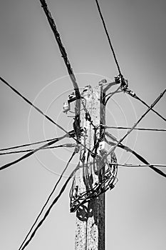 Cement pole with wiring for landlines photo