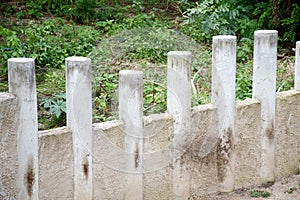 Cement post in nature garden