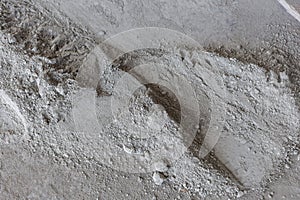 Cement is a powder ground from broken bags.