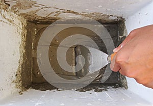 Cement powder Mixed by hand and Metal trowel. Wall Painting Preparation at home