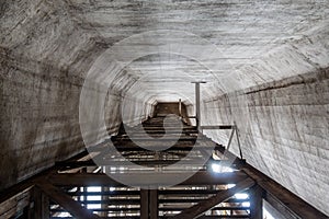The cement silo represents data silos in computer science, which isolates data