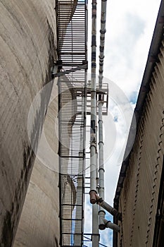 The cement silo represents data silos in computer science, which isolates data