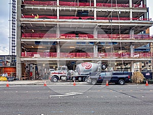 Cement truck mixer in front of a construction site at the corner of Bellevue Way and NE 2nd Street downtown, near Safeway grocery