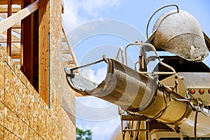 Cement truck mixer pouring cement fresh concrete