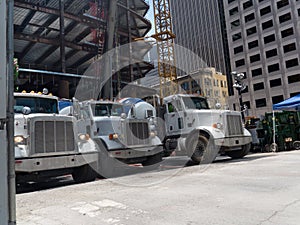 Cement trucks in line discharging