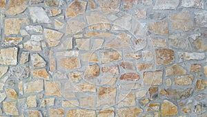 Cement wall with irregular stones