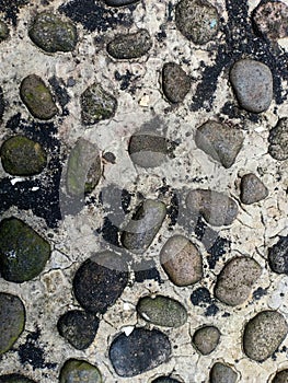 Cemented rocks or buried on the road