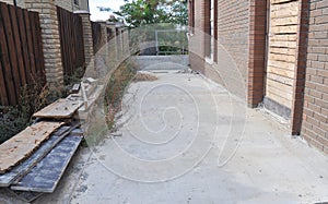 Cemented soil of the backyard of the house before laying pavers photo