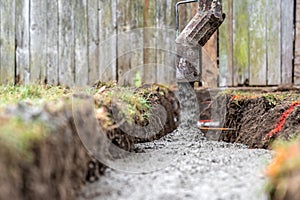 cementing the foundation in the ground when building a house