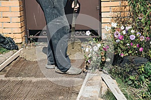 Cementing garden paths on top of metal mesh, construction work in the garden