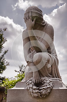 Cemetary Statue of a Woman Expressing Grief