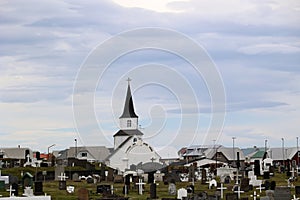 Cemetery and church of the small village of Heimaey, on the island of the same name in the Vestmannaeyjar-Westman Islands- Iceland