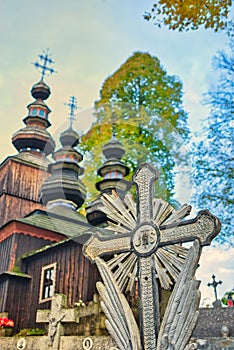 Cemetery cross in the front of the church of the Sleeping Most Holy Mother of God in Hunkovce