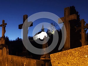 Cemetery crosses and church