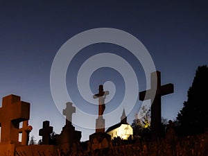 Cemetery crosses and church