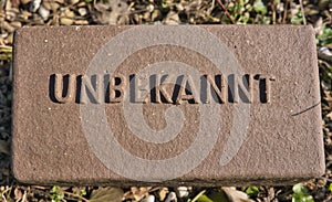 Cemetery grave marker for unknown person with german letters UNBEKANNT