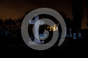 Cemetery graveyard tombstones cross night, Leuven, Belgium photo