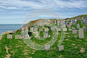 Cemetery with headstones overlooking the ocean.