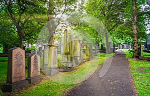 Cemetery near Parish Church of St Cuthbert in the Princes Street Gardens in a sunny summer afternoon. Edinburgh, Scotland