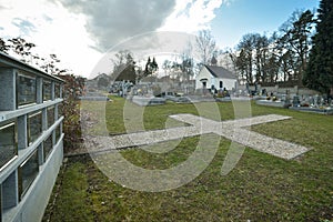 Cemetery with tombstones in the shape of a cross, angels. Many decorated graves