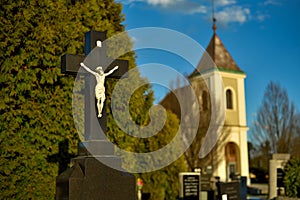 Cemetery with tombstones in the shape of a cross, angels. Many decorated graves