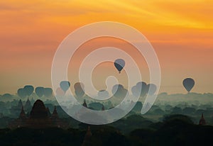 Cenic sunrise with many hot air balloons above Bagan in Myanmar