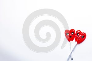 Cenital plane. Two intertwined heart-shaped lollipops. photo