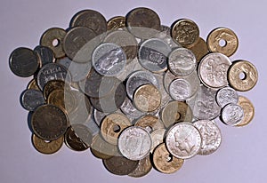 Cenital view of a pile of peseta coins with white background photo
