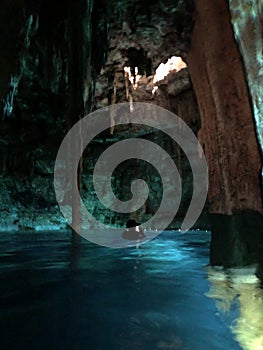 Cenote cavern in Yucatan, Mexico with crystal clear water.