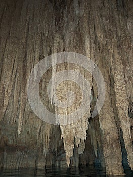 Cenote cavern in Yucatan, Mexico with crystal clear water.