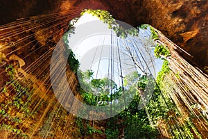 Cenote with lovely opening in the form of heart photo