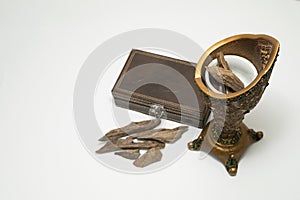 Censer, Agar wood : Oud, incense Chips isolated on a background photo
