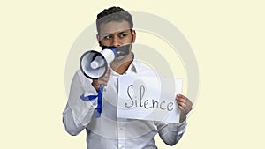 Censored male protester with megaphone.