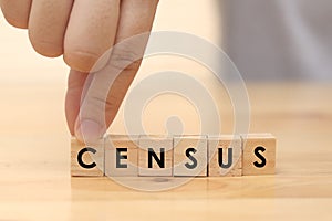 CENSUS, man arrange word text written on wooden alphabet letterpress cubes