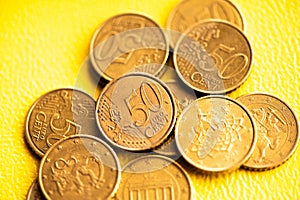 50 Cent Euro Coins On Yellow Background