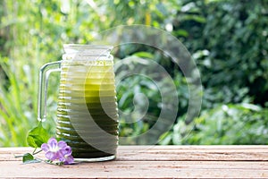 Centella asiatica iced drink water on wooden table, Healthy drink