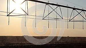 Center pivot irrigation at sunset 2