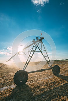 Center pivot irrigation system with drop sprinklers in field