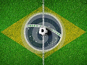 Center of soccer pitch or field with flag of Brazil