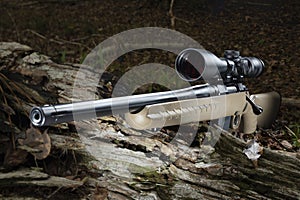 Centerfire bolt action hunting rifle in a forest