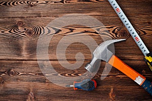 centimeter tape on wooden table background image hammer top view