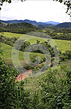 Central America landscape with greenery and blue sky with clouds, Honduras