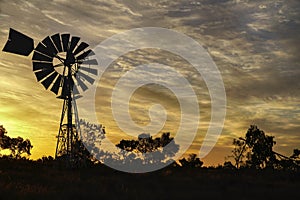 Central Australia windmill at sunset