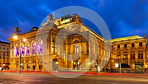 Central avenue of Vienna and illuminated State Opera on winter twilight