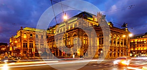 Central avenue of Vienna and illuminated State Opera on winter twilight