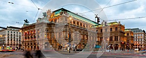 Central avenue of Vienna and illuminated State Opera on winter twilight